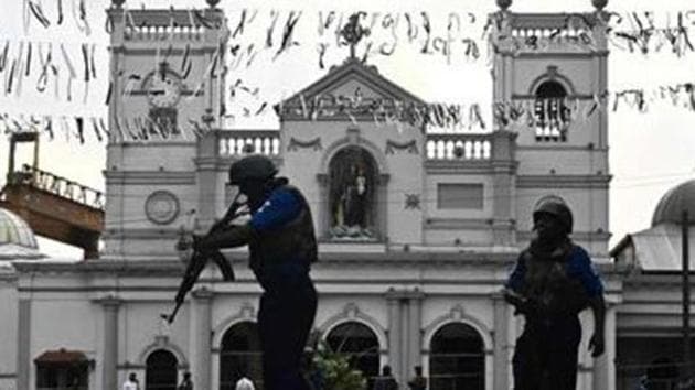 Security personnel stand guard in front of St. Anthony's Shrine in Colombo on April 23, 2019, two days after a series of bomb blasts targeting churches and luxury hotels in Sri Lanka.(AFP)