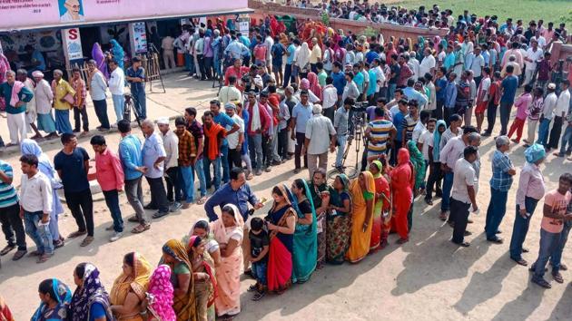 Voters stand in a queue to cast their vote at a polling station, in Begusarai district, Bihar. In first five hours of voting, 23% polling was recorded till 12 noon on Monday for elections to 72 seats across nine states in the fourth phase of 2019 Lok Sabha elections amid PM Modi’s appeal for ‘record voting’ and reports of EVM glitches and clashes from several areas. (PTI) Voters stand in a queue to cast their vote at a polling station, in Begusarai district, Bihar. In first five hours of voting, 23% polling was recorded till 12 noon on Monday for elections to 72 seats across nine states in the fourth phase of 2019 Lok Sabha elections amid PM Modi’s appeal for ‘record voting’ and reports of EVM glitches and clashes from several areas. (PTI)