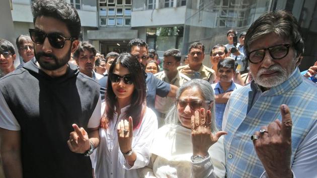 Bollywood star Amitabh Bachchan, son Abhishek Bachchan, Aishwarya Rai Bachchan and Jaya Bachchan show ink marks on their fingers after casting their votes at a polling station in Mumbai.(REUTERS)