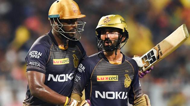 Kolkata Knight Riders' cricketer Andre Russell (L) talks with captain Dinesh Karthik during the 2019 Indian Premier League. (AFP)