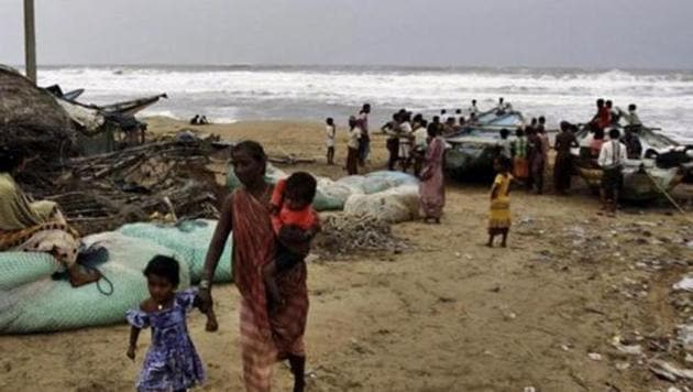 A woman evacuates the coast with her children in Ganjam district, Odisha following a cyclone alert. (AP Photo) A woman evacuates the coast with her children in Ganjam district, Odisha following a cyclone alert. (AP Photo)