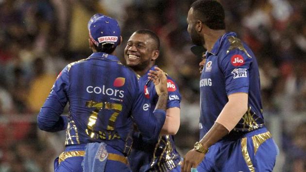 Mumbai Indians teammates congratulate Evin Lewis, center for taking a wicket of Kolkata Knight Riders' Chris Lynn. (AP)