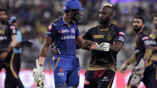 Kolkata Knight Riders' Andre Russell, right congratulates Mumbai Indians' Hardik Pandya for making ninety-one runs. (AP)