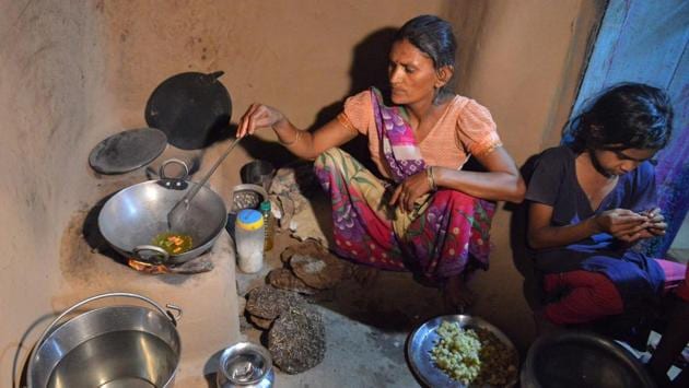 In Nisarpura, Jamintra Devi (C) applied for a connection but local officials would not give it unless she paid a bribe. “We come back from work at midnight or 1:00am and then we have to cook on wood,” said Devi, who is not related to Reena. Some recipients say their kits have effectively been repossessed. (Narinder Nanu / AFP) In Nisarpura, Jamintra Devi (C) applied for a connection but local officials would not give it unless she paid a bribe. “We come back from work at midnight or 1:00am and then we have to cook on wood,” said Devi, who is not related to Reena. Some recipients say their kits have effectively been repossessed. (Narinder Nanu / AFP)