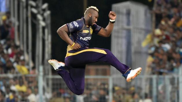 Kolkata: Kolkata Knight Riders (KKR) Andre Russell jumps into air after taking wicket of Mumbai Indians' Evin Lewis. (PTI)