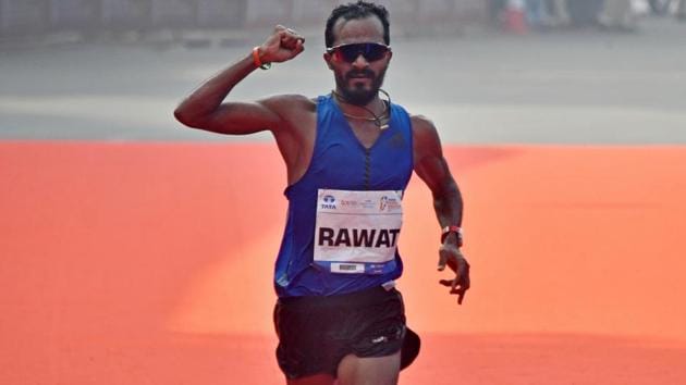 Indian Elite winner, Nitendra Singh Rawat finishes top among Indian contestants during Tata Marathon.(Hindustan Times)