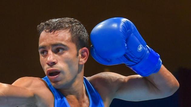 Jakarta: India's Amit Panghal (Blue) and PR Korea's Ryong Jong compete in the Men's Light Fly (46-49kg) Quarterfinal boxing event in the 18th Asian Games 2018 in Jakarta, Indonesia on Wednesday, Aug 29, 2018.(PTI)