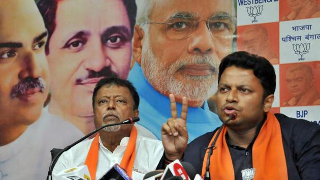 BJP candidate from Jadavpur parliamentary constituency Anupam Hazra speaks as party leader Mukul Roy (L) looks on during a press conference at the party office in Kolkata, Tuesday, April 30, 2019. (PTI) BJP candidate from Jadavpur parliamentary constituency Anupam Hazra speaks as party leader Mukul Roy (L) looks on during a press conference at the party office in Kolkata, Tuesday, April 30, 2019. (PTI)
