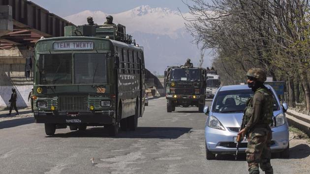 An army convoy moves on Srinagar- Jammu national highway on the outskirts of Srinagar.(ANI File Photo)