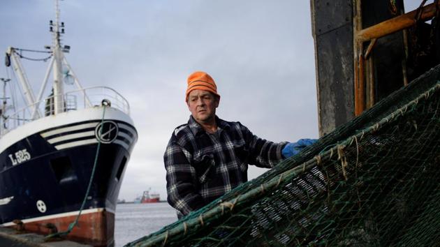 Allan Jorgensen, a fisherman for 44 years, helps wind a net back onto the ship Linette. The problem for Danish fishermen is that as the water warms due to climate change, the fish they rely on tend to swim towards colder waters nearer the UK and further north. Under a ‘no deal’ Brexit, Britain can choose to close its sea border completely overnight or wait until the end of 2019, according to the Danish fishing minister. (Andrew Kelly / REUTERS) Allan Jorgensen, a fisherman for 44 years, helps wind a net back onto the ship Linette. The problem for Danish fishermen is that as the water warms due to climate change, the fish they rely on tend to swim towards colder waters nearer the UK and further north. Under a ‘no deal’ Brexit, Britain can choose to close its sea border completely overnight or wait until the end of 2019, according to the Danish fishing minister. (Andrew Kelly / REUTERS)