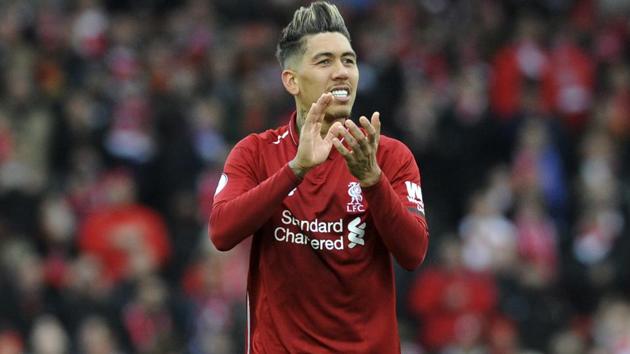 Liverpool's Roberto Firmino applauds to supporters at the end of the English Premier League match.(AP)