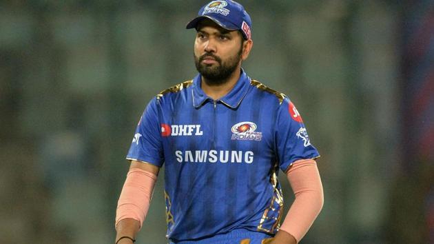 Mumbai Indians cricketerand team captain Rohit Sharma walks back after winning the 2019 Indian Premier League (IPL) Twenty20 cricket match between Delhi Capitals and Mumbai Indians at the Feroz Shah Kotla cricket stadium in New Delhi on April 18, 2019.(AFP)