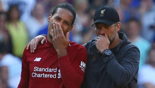 Liverpool's German manager Jurgen Klopp (R) talks with Liverpool's Dutch defender Virgil van Dijk ( (AFP) Liverpool's German manager Jurgen Klopp (R) talks with Liverpool's Dutch defender Virgil van Dijk ( (AFP)