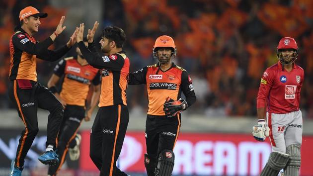 SRH bowler Rashid Khan celebrates with teammates the wicket of KXIP batsman Mayank Agarwal. (PTI)