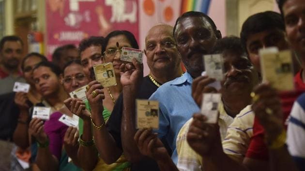 Mumbai, India - March. 29, 2019: Voter's stand in queue show their voter ID card to cast their vote at Colaba Municipal School,Colaba in Mumbai, India, on Monday, March 29, 2019. (Photo by Anshuman Poyrekar/Hindustan Times)(Anshuman Poyrekar/HT Photo)
