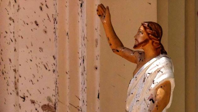 Blood stains are seen on the wall and on a Jesus Christ statue at the St. Sebastian’s Church after a blast in Negombo, north of Colombo, Sri Lanka. Nearly a week later, even after the cleaners have come through, the blood can still be seen clearly. The statues of Jesus and the saints are still speckled with fragments of shrapnel. The smell of death is everywhere, though the bodies are long gone. (AP) Blood stains are seen on the wall and on a Jesus Christ statue at the St. Sebastian’s Church after a blast in Negombo, north of Colombo, Sri Lanka. Nearly a week later, even after the cleaners have come through, the blood can still be seen clearly. The statues of Jesus and the saints are still speckled with fragments of shrapnel. The smell of death is everywhere, though the bodies are long gone. (AP)