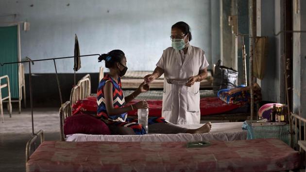 A tuberculosis patient receives medicines from a nurse at a hospital in Guwahati.(AP)