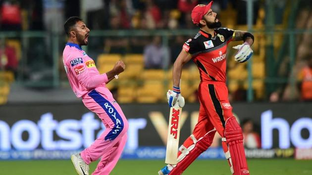 RCB batsman Virat Kohli returns to the pavilion as RR bowler Shreyas Gopal celebrates. (PTI)