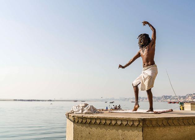 A sadhu dancing on a platform at Meer Ghat in Varanasi.(LightRocket via Getty Images) A sadhu dancing on a platform at Meer Ghat in Varanasi.(LightRocket via Getty Images)