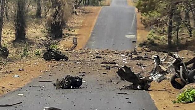 Mangled remains of a police vehicle, carrying 16 security personnel that was allegedly blasted by Maoists using IED, in Gadchiroli, Wednesday(PTI)