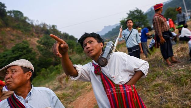 Pa’O ethnic people watch homemade rockets soar during Pwe Lu Phaing festival in Nantar, Shan state. They are overwhelmingly Buddhist but many intertwine animism with their faith, believing they descend from a she-dragon and a wizard with mystical powers, known as a “weiza”. “Calling the rain like this every year means we get bumper rice harvests,” co-organiser Rike Kham told AFP at the festival’s 144th edition. (Ye Aung Thu / AFP)