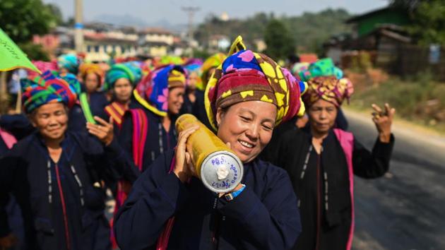 One group of women was challenging the traditionally testosterone-driven festivities. They danced into the village for the second year holding high their own rocket, albeit full of donation money rather than gunpowder. But next year they will take part with “real rockets”, Mhoe Phar Ohon Ye, 67, said smiling, adding that women from other villages are following their lead. (Ye Aung Thu / AFP)