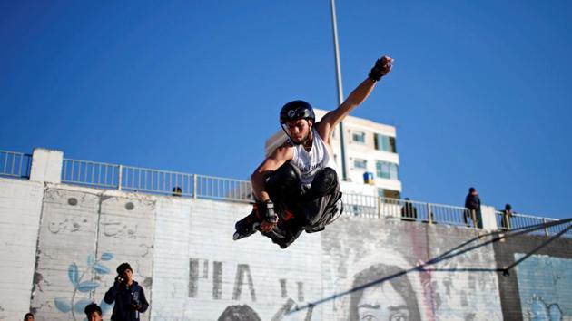 Mohammad Al-Sawalhe performs a jump during a practice session. “I try to change their thinking and turn it from thinking about the blockade, borders, and death, to thinking about sport” he said about the skaters. (Mohammed Salem / REUTERS) Mohammad Al-Sawalhe performs a jump during a practice session. “I try to change their thinking and turn it from thinking about the blockade, borders, and death, to thinking about sport” he said about the skaters. (Mohammed Salem / REUTERS)