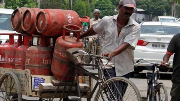 Sudhanshu Singh of Vaishali Enterprises, Danapur said ten employees were deputed to paste stickers on LPG cylinders for delivery to about 20,000 customers in both urban and rural areas.(HT Photo)