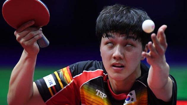 South Korea’s An Jaeh-Yun serves the ball to South Korea’s Jang Woo-Jin during the men’s singles quarter-final match at the ITTF World Table Tennis Championships in Budapest, Hungary. (Attila Kisbenedek / AFP)