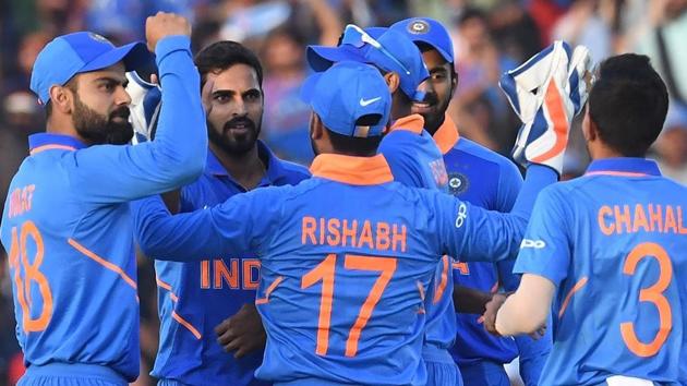 India cricketer Bhuvneshwar Kumar (2L) celebrates the wicket of Australia cricket captain Aaron Finch with captain Virat Kohli (L) and teammates during the fourth one-day international (ODI) cricket match between India and Australia at the Punjab Cricket Association Stadium in Mohali on March 10, 2019. (AFP) India cricketer Bhuvneshwar Kumar (2L) celebrates the wicket of Australia cricket captain Aaron Finch with captain Virat Kohli (L) and teammates during the fourth one-day international (ODI) cricket match between India and Australia at the Punjab Cricket Association Stadium in Mohali on March 10, 2019. (AFP)