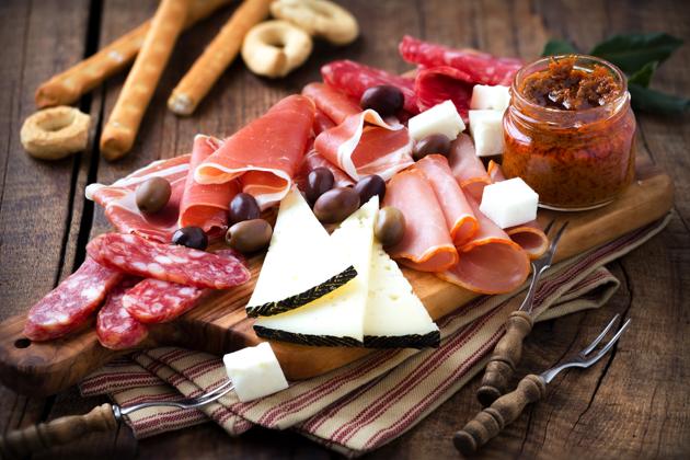 If you really want to go all out, put together a cold cuts platter — sausage, ham, whatever sorts of cheese you have lying around, olives, pretzels and bread sticks.(iStock)