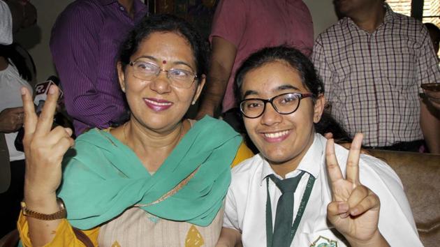 Ghaziabad: Hansika Shukla, CBSE class 12th topper, poses for a photograph with her mother after the results were declared, in Ghaziabad, Thursday, May 02, 2019. Shukla scored 499 out of 500 marks. (PTI Photo)(PTI5_2_2019_000037B)(PTI)