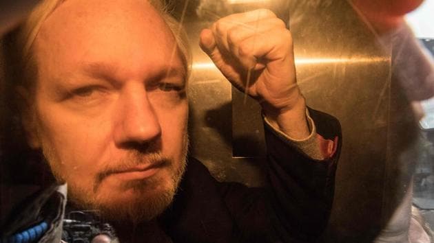 WikiLeaks founder Julian Assange arrives at court in London to be sentenced for bail violation. Assange was found guilty of breaching a British court order seven years ago, when he took refuge in Ecuador’s London embassy to avoid extradition to Sweden. He was sentenced to 50 weeks in prison. (Daniel Leal-Olivas / AFP)