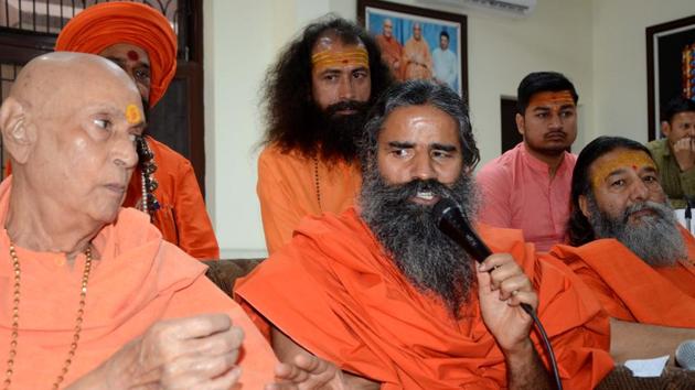Ramdev, former Shankaracharya (left) Mahamdanleshwar Harichetnan and Maharaj (right) at a press conference in Haridwar to condemn Marxist leader Sitaram Yechury controversial remarks on Hindu religion. (HT PHOTO) Ramdev, former Shankaracharya (left) Mahamdanleshwar Harichetnan and Maharaj (right) at a press conference in Haridwar to condemn Marxist leader Sitaram Yechury controversial remarks on Hindu religion. (HT PHOTO)