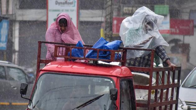 Commuters cover themselves with plastic sheet as they travel atop a van during a rainfall due to the cyclone Fani, in Guwahati. The cyclone’s wind speeds reached as high as 200 kilometers per hour, according to the India Meteorological Department. (PTI) Commuters cover themselves with plastic sheet as they travel atop a van during a rainfall due to the cyclone Fani, in Guwahati. The cyclone’s wind speeds reached as high as 200 kilometers per hour, according to the India Meteorological Department. (PTI)