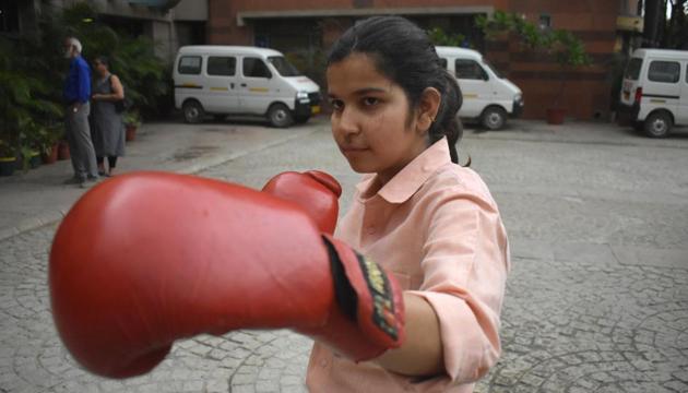 Shivani Sharma, who won a bronze medal in state open boxing championship last year, wants to become an IAS officer. She scored 89.3% in humanities in her board exams.(Yogesh Sharma/HT Photo)