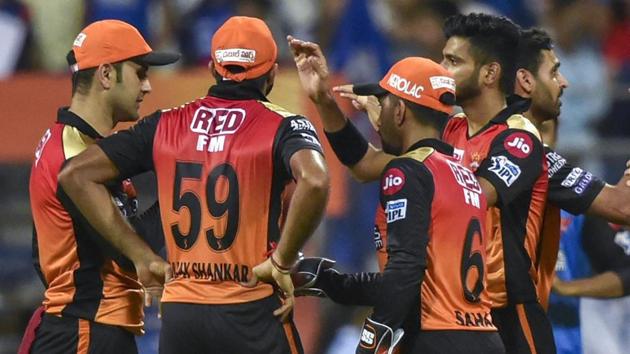 File image of players of Sunrisers Hyderabad celebrate after the fall of a wicket.(PTI)