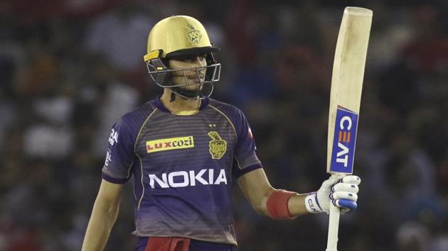 Kolkata Knight Riders’ Shubman Gill raises his bat after scoring a half-century against Kings XI Punjab.(AP)