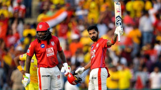 Kings XI Punjab cricketer KL Rahul (R) raises his bat after he scoring his fifty.(AFP) Kings XI Punjab cricketer KL Rahul (R) raises his bat after he scoring his fifty.(AFP)