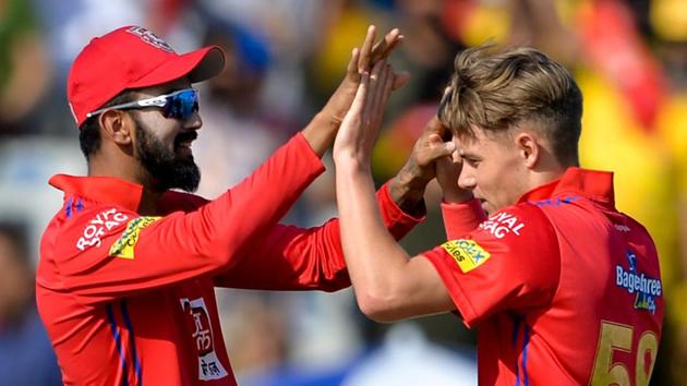 Kings XI Punjab bowler Sam Curran (R) celebrates with his teammate KL Rahul.(AFP)