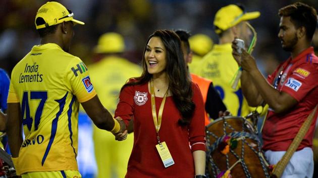Kings XI Punjab team owner Preity Zinta (C) shakes hands with Chennai Super Kings cricketer Dwayne Bravo. (AFP) Kings XI Punjab team owner Preity Zinta (C) shakes hands with Chennai Super Kings cricketer Dwayne Bravo. (AFP)