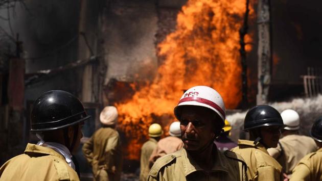 Fire fighters douse fire in a chemical factory at Naraina Industrial area, near Payal Cinema, in New Delhi. (Vipin Kumar / HT Photo) Fire fighters douse fire in a chemical factory at Naraina Industrial area, near Payal Cinema, in New Delhi. (Vipin Kumar / HT Photo)