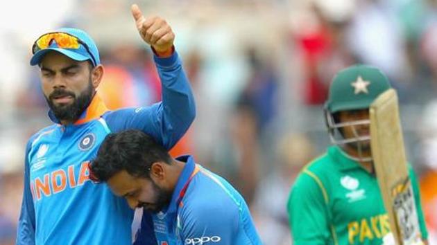 Kedar Jadhav of India celebrates the wicket of Babar Azam of Pakistan with Virat Kohli. (Getty Images) Kedar Jadhav of India celebrates the wicket of Babar Azam of Pakistan with Virat Kohli. (Getty Images)