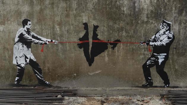 A wall graffiti seen in Mumbai depicting Indian National Congress (INC) party leader Rahul Gandhi (L) and Prime Minister Narendra Modi of Bharatiya Janata Party (BJP) in a tug of war over India. (Indranil Mukherjee/ AFP) A wall graffiti seen in Mumbai depicting Indian National Congress (INC) party leader Rahul Gandhi (L) and Prime Minister Narendra Modi of Bharatiya Janata Party (BJP) in a tug of war over India. (Indranil Mukherjee/ AFP)
