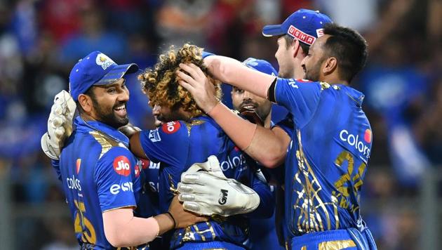 Mumbai Indians player Lasith Malinga (C) celebrates with captain Rohit Sharma (L) and teammates after taking the wicket of Kolkata Knight Riders batsman Andre Russell(AFP) Mumbai Indians player Lasith Malinga (C) celebrates with captain Rohit Sharma (L) and teammates after taking the wicket of Kolkata Knight Riders batsman Andre Russell(AFP)