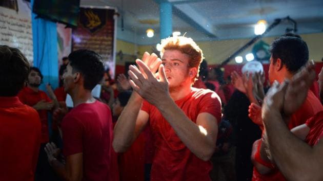Iraqis Shiites beat their chests in mourning, at their local mosque in the town of Midhatiya, about 100 kilometres (60 miles) south of the capital Baghdad. In parts of conservative Iraq, a religious movement within the Shiite sect has adapted the traditional “latmiyat” -- chanted verses mourning Muslim icons -- to Western-style rap in an effort to keep youth interested in religion. It appears to be working. (Haidar Hamdani / AFP) Iraqis Shiites beat their chests in mourning, at their local mosque in the town of Midhatiya, about 100 kilometres (60 miles) south of the capital Baghdad. In parts of conservative Iraq, a religious movement within the Shiite sect has adapted the traditional “latmiyat” -- chanted verses mourning Muslim icons -- to Western-style rap in an effort to keep youth interested in religion. It appears to be working. (Haidar Hamdani / AFP)