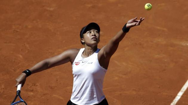 Japan's Naomi Osaka serves the ball during her match against Slovakia's Dominika Cibulkova during the Madrid Open tennis tournament, Sunday, May 5, 2019, in Madrid, Spain. (AP) Japan's Naomi Osaka serves the ball during her match against Slovakia's Dominika Cibulkova during the Madrid Open tennis tournament, Sunday, May 5, 2019, in Madrid, Spain. (AP)