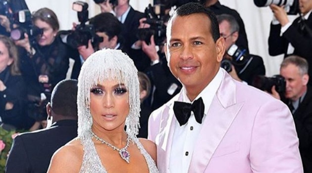 Jennifer Lopez stole the show in a silver fringe beaded Versace dress featuring a sky-high slit and plunging neckline.(Instagram)