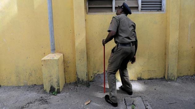 A Sri Lankan police officer searches a school premises ahead of schools’ second term starting on May 06. State schools in Sri Lanka resumed classes on Monday amid tight security after the Easter Sunday bombings, but many anxious parents kept their children at home over fears of more attacks by Islamic militants. (Dinuka Liyanawatte / REUTERS) A Sri Lankan police officer searches a school premises ahead of schools’ second term starting on May 06. State schools in Sri Lanka resumed classes on Monday amid tight security after the Easter Sunday bombings, but many anxious parents kept their children at home over fears of more attacks by Islamic militants. (Dinuka Liyanawatte / REUTERS)