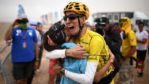 Sapin's Alex Roca Campillo celebrates with his girlfriend at the end of Stage 5. (Franck Fife / AFP) Sapin's Alex Roca Campillo celebrates with his girlfriend at the end of Stage 5. (Franck Fife / AFP)